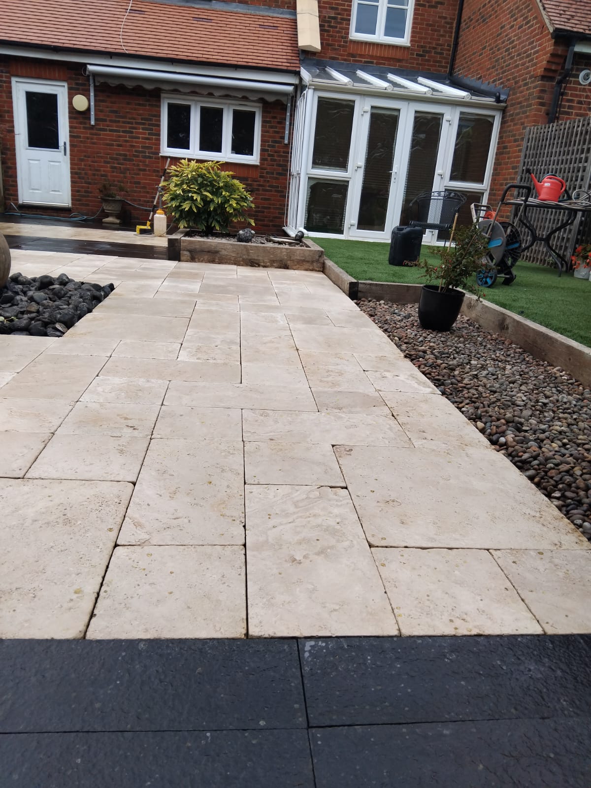 Travertine patio restored to a clean, bright finish